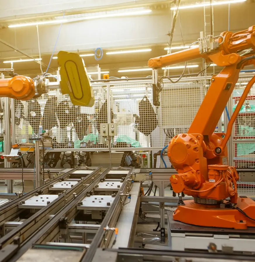 a factory filled with lots of orange machines